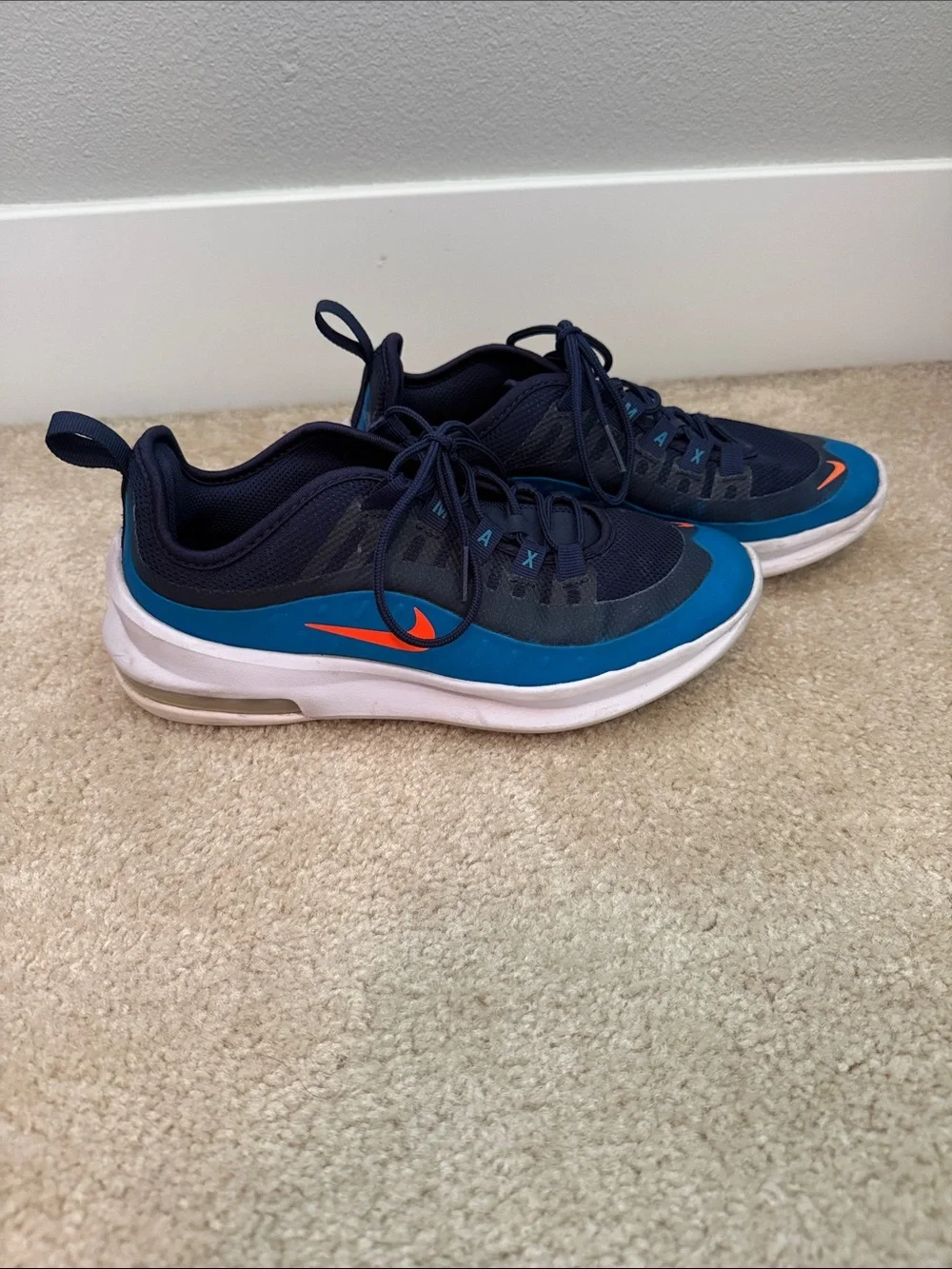Boys size 4.5 Nike air Navy and Blue Sneakers with Orange Swoosh